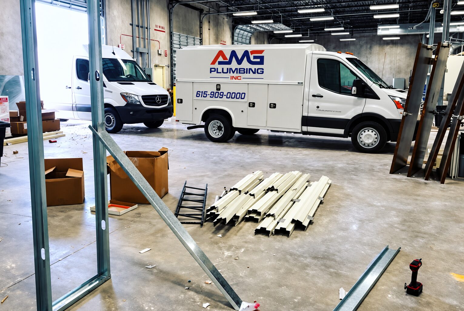 AMG Plumbing service vans at a commercial buildout